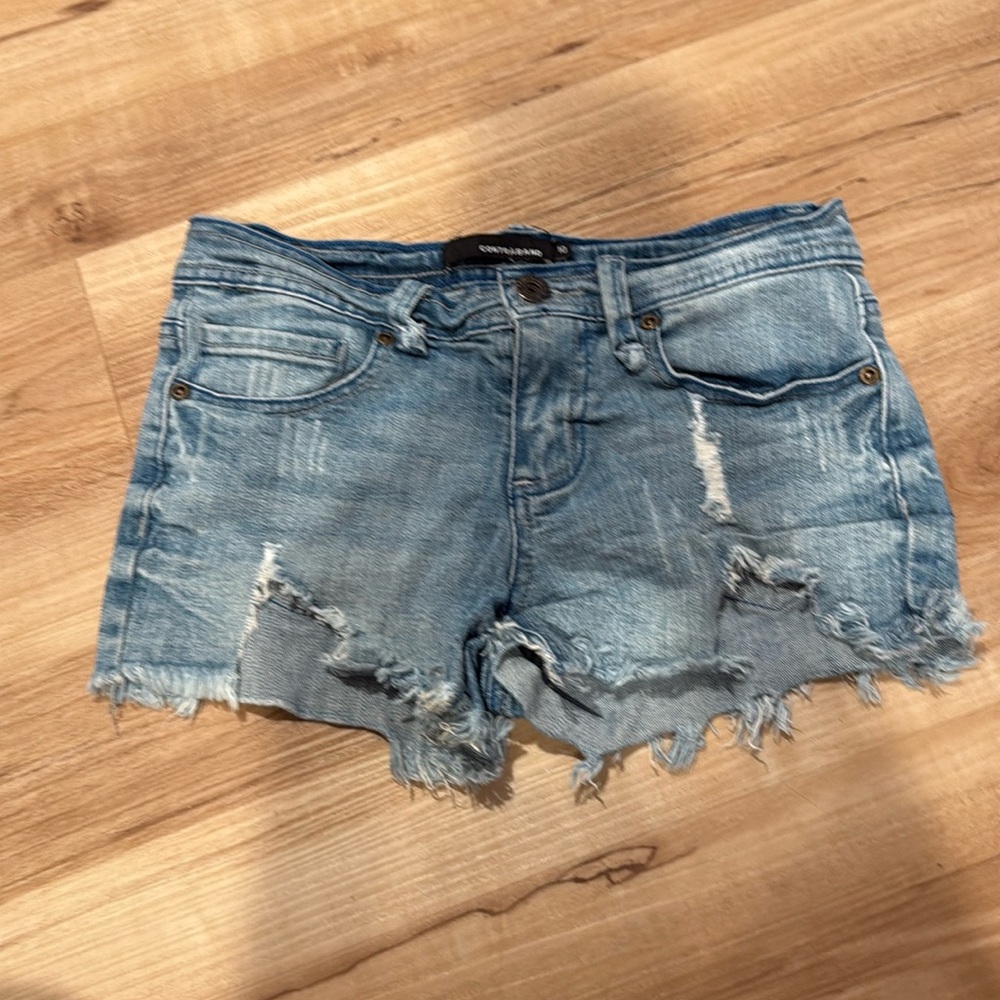 Size 10 contraband ripped & distressed denim shorts 
Orig. Purchased  at Denny’s